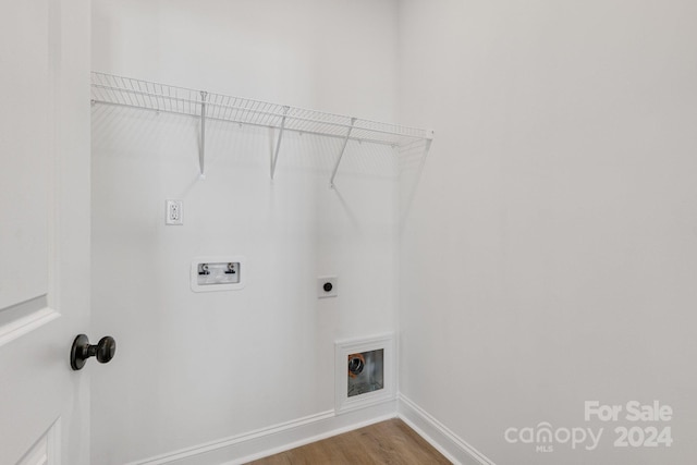 laundry room featuring washer hookup, electric dryer hookup, and wood-type flooring