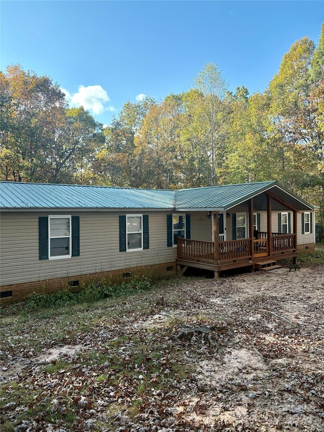 manufactured / mobile home with a wooden deck