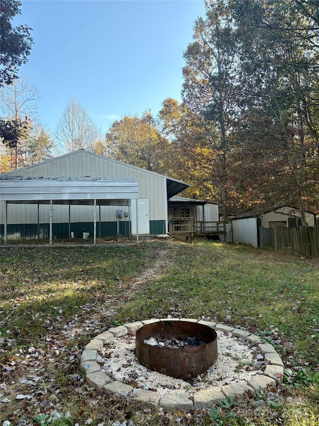 view of outbuilding with a fire pit