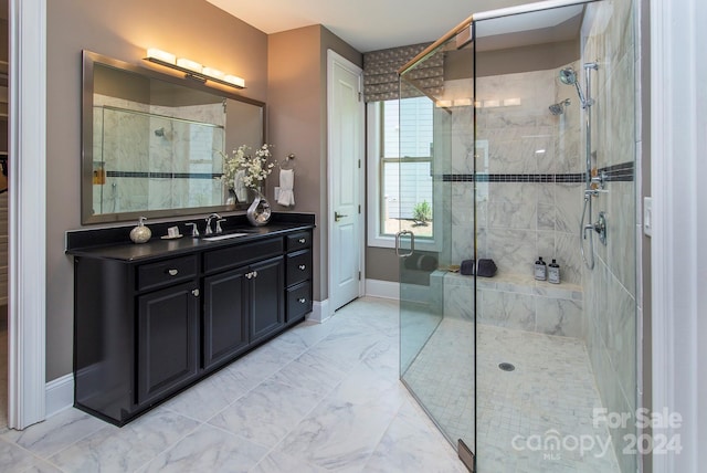 bathroom with vanity and a shower with shower door