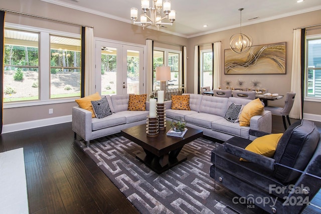 living room with dark wood-type flooring, ornamental molding, plenty of natural light, and french doors