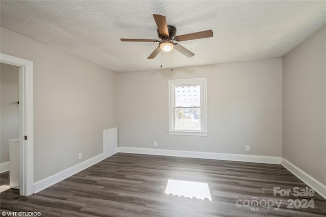 unfurnished room with dark wood-type flooring, a textured ceiling, and ceiling fan