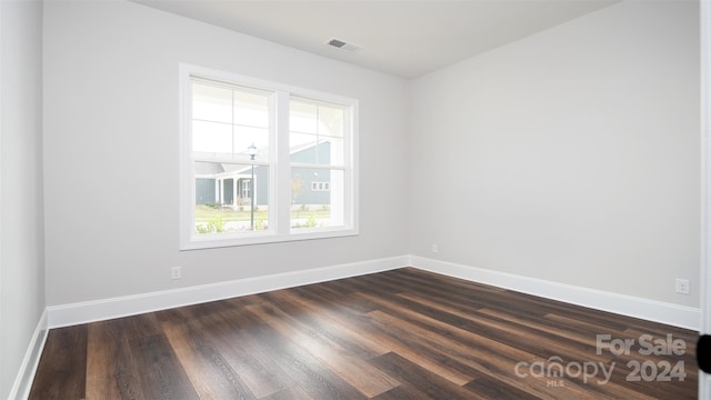 empty room featuring dark hardwood / wood-style floors