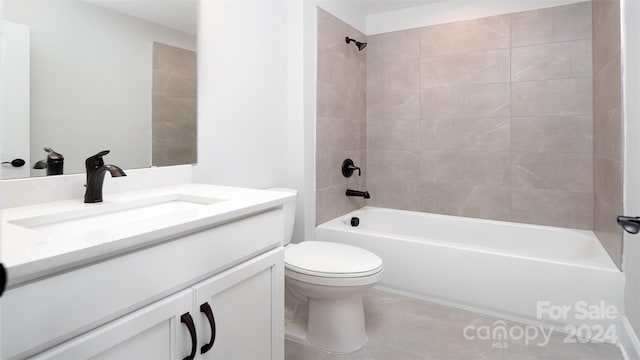 full bathroom with vanity, tile patterned floors, tiled shower / bath combo, and toilet