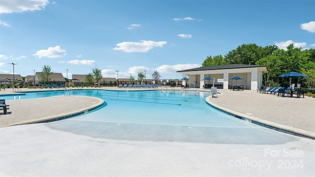 view of swimming pool featuring a patio area