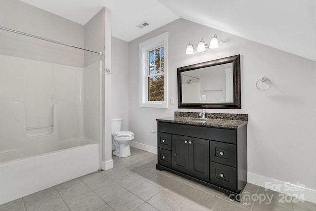 full bathroom with tile patterned floors, bathing tub / shower combination, lofted ceiling, toilet, and vanity