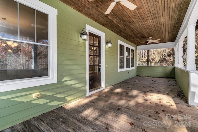 deck with ceiling fan and a porch