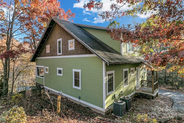 view of property exterior with central AC