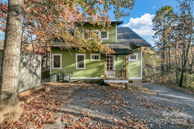 back of property with crawl space and cooling unit
