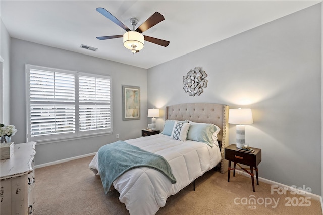 bedroom featuring light colored carpet and ceiling fan