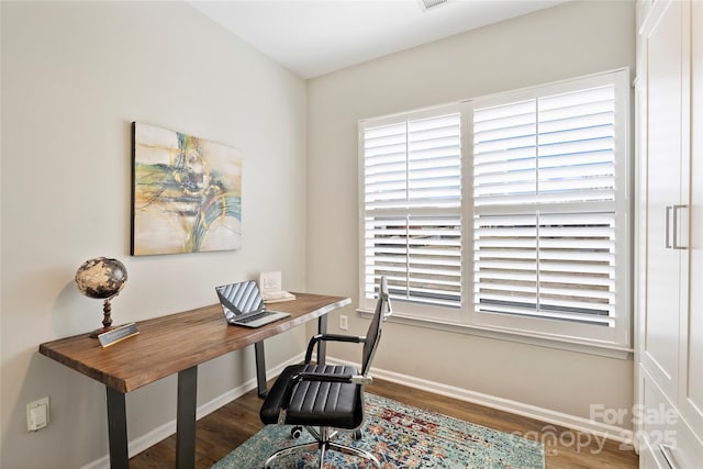 office space with dark hardwood / wood-style flooring