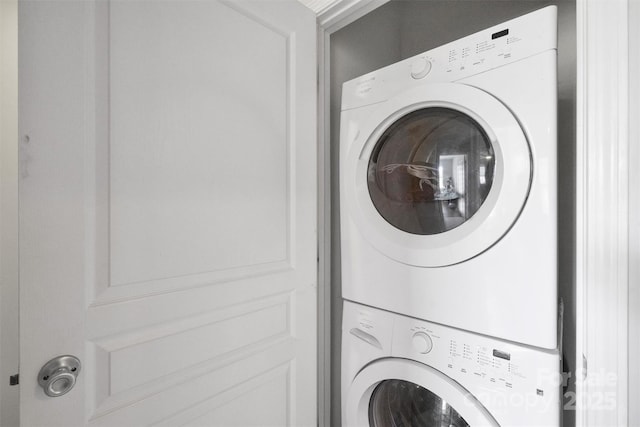 laundry area with stacked washer / dryer