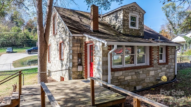 view of home's exterior featuring a deck