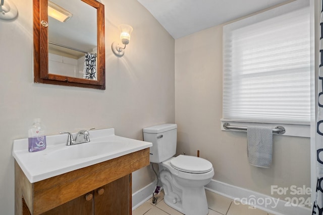 bathroom featuring tile patterned flooring, vanity, a shower with shower curtain, and toilet