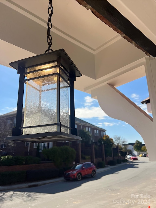 exterior space featuring beam ceiling and concrete floors