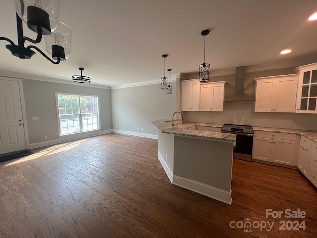 kitchen with wall chimney range hood, white cabinetry, stainless steel stove, and dark hardwood / wood-style flooring