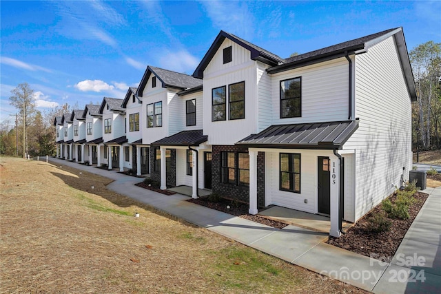 view of front of home featuring central AC unit