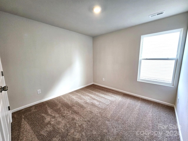 empty room with carpet flooring