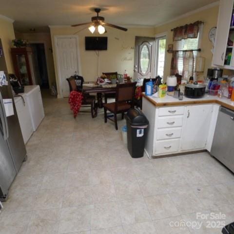 kitchen featuring refrigerator, white cabinetry, dishwasher, ornamental molding, and ceiling fan