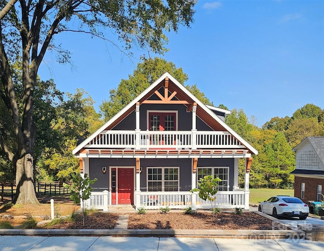 view of front of house with a porch and a balcony