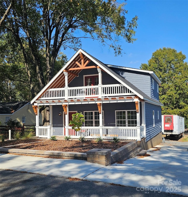 view of front of house featuring a balcony