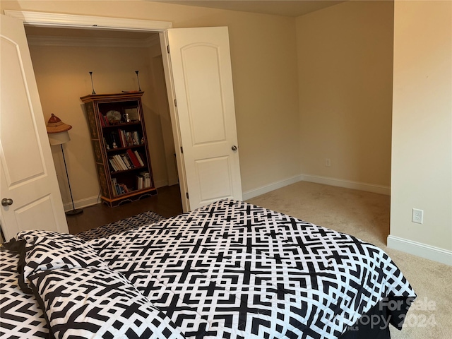 bedroom featuring dark colored carpet