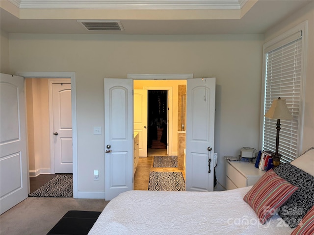 bedroom with light colored carpet and ornamental molding