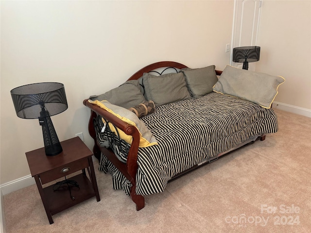 bedroom featuring light colored carpet