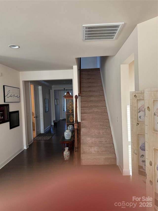 stairs featuring baseboards and recessed lighting