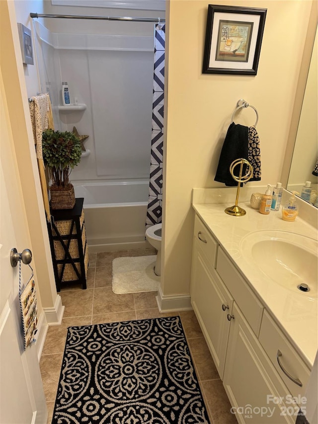 bathroom featuring toilet, tile patterned floors, vanity, and shower / tub combo with curtain