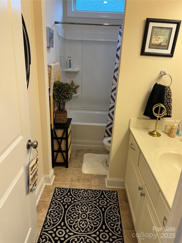 bathroom with tile patterned floors, toilet, vanity, and shower / tub combo
