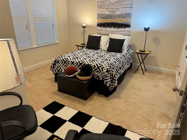 carpeted bedroom with baseboards
