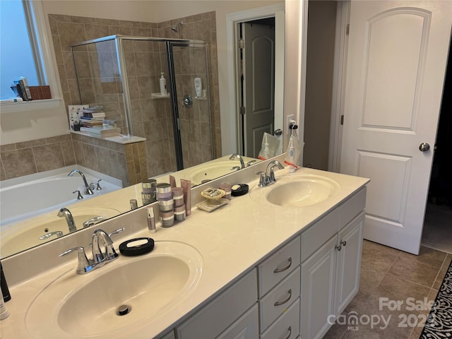 bathroom with a stall shower, tile patterned flooring, double vanity, and a garden tub