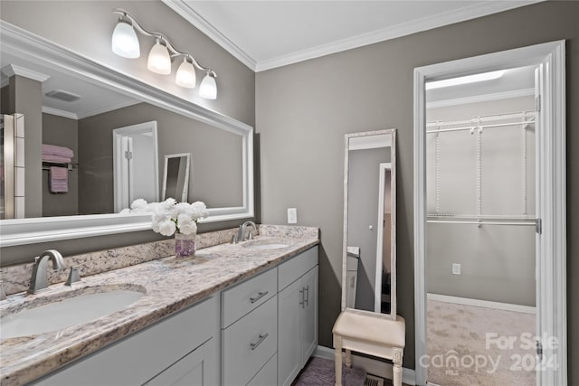 bathroom with vanity and crown molding