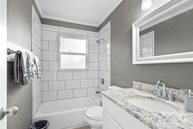 full bathroom with ornamental molding, vanity, tiled shower / bath combo, and toilet