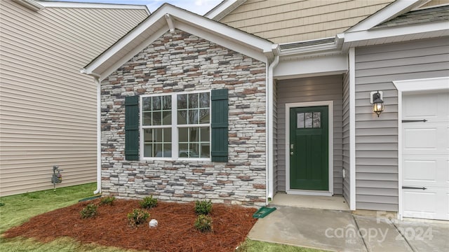 property entrance with a garage