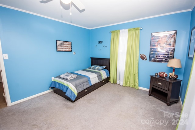 bedroom featuring ceiling fan, carpet flooring, and crown molding