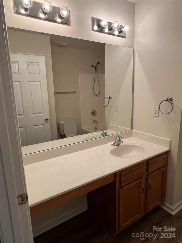 full bathroom with vanity, shower / washtub combination, and toilet