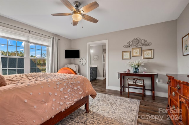 bedroom with dark wood-type flooring, ensuite bathroom, and ceiling fan