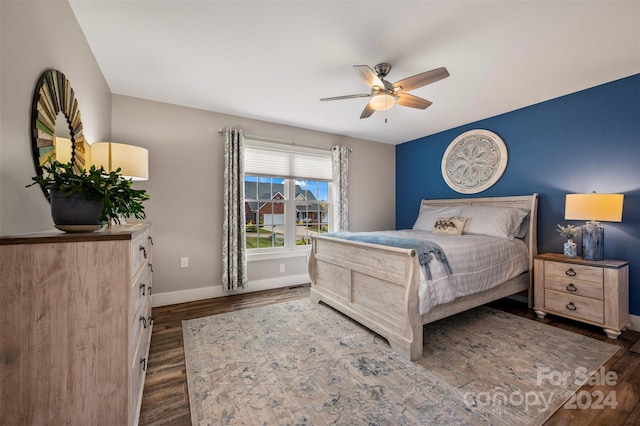 bedroom featuring dark wood-type flooring and ceiling fan