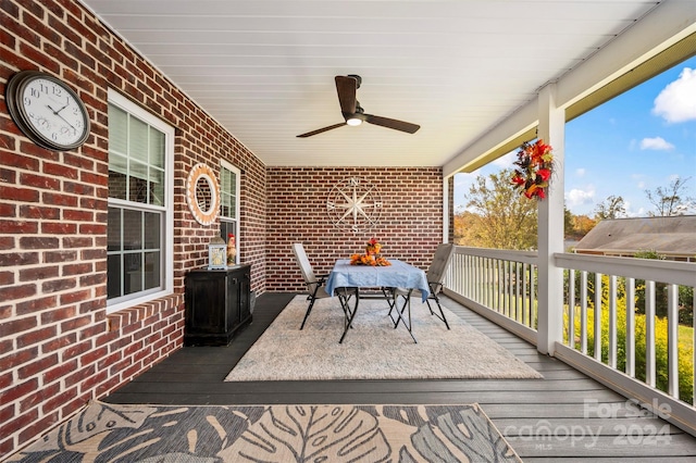 wooden terrace featuring ceiling fan