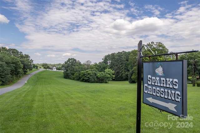 view of home's community with a yard