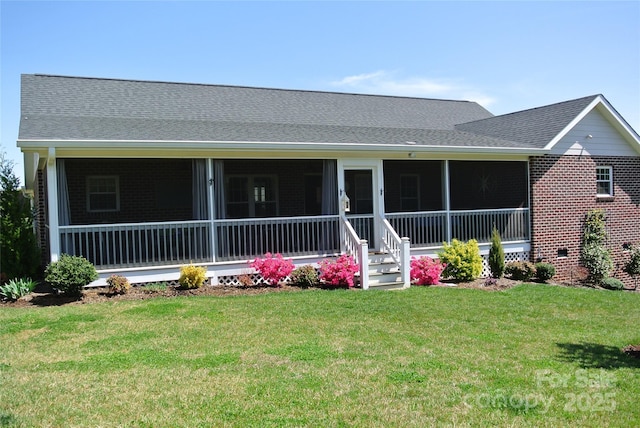 128 Augusta Dr, Spindale, NC 28160 - view of front of house featuring brick siding, a shingled roof, and a front lawn