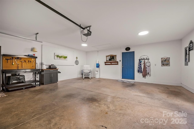 128 Augusta Dr, Spindale, NC 28160 - garage with baseboards, a garage door opener, and a workshop area