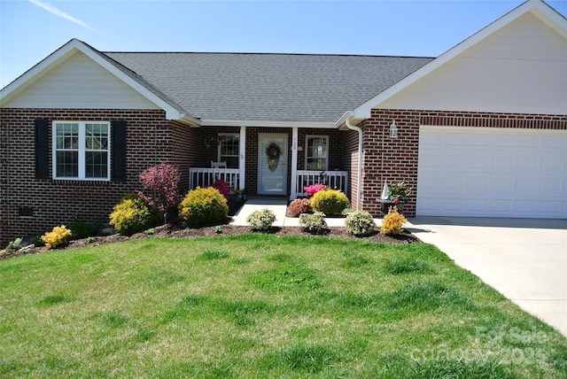 128 Augusta Dr, Spindale, NC 28160 - ranch-style home featuring a garage, concrete driveway, brick siding, a front lawn, and covered porch