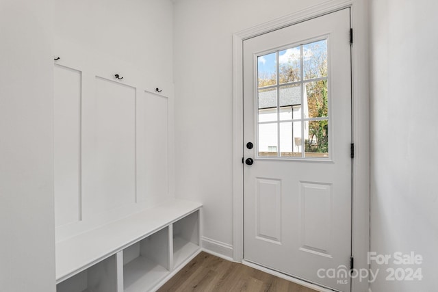 mudroom with light wood-style floors and baseboards