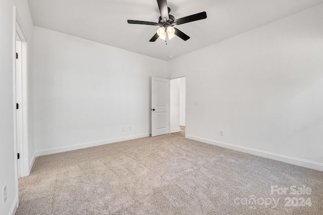 unfurnished room featuring light carpet and ceiling fan