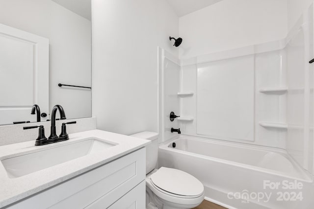 full bathroom with  shower combination, vanity, and toilet