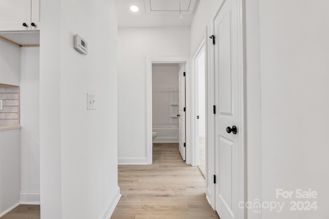 corridor featuring light hardwood / wood-style flooring