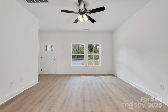 606 Meadow St, Spencer, NC 28159 - unfurnished living room with ceiling fan and light wood-type flooring